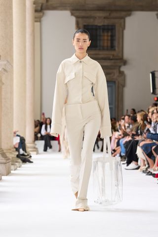 a Sportmax model walks the spring/summer 2025 runway wearing skinny trousers