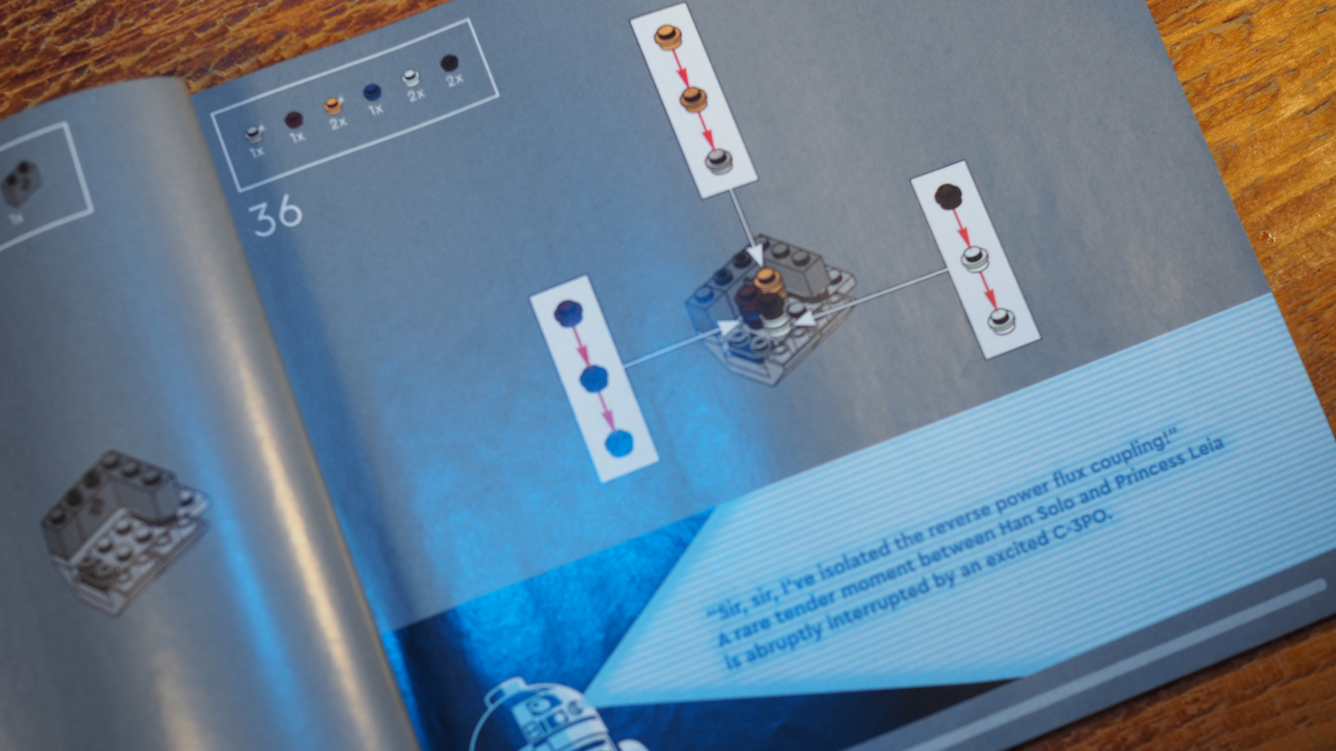 Lego Millennium Falcon instruction booklet laid out on a wooden surface