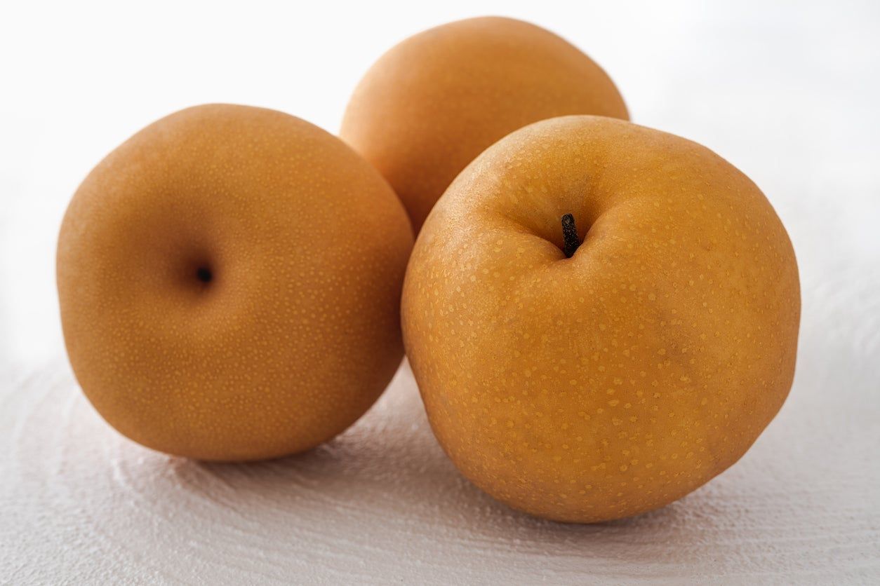 Three Giant Korean Pears on a Table