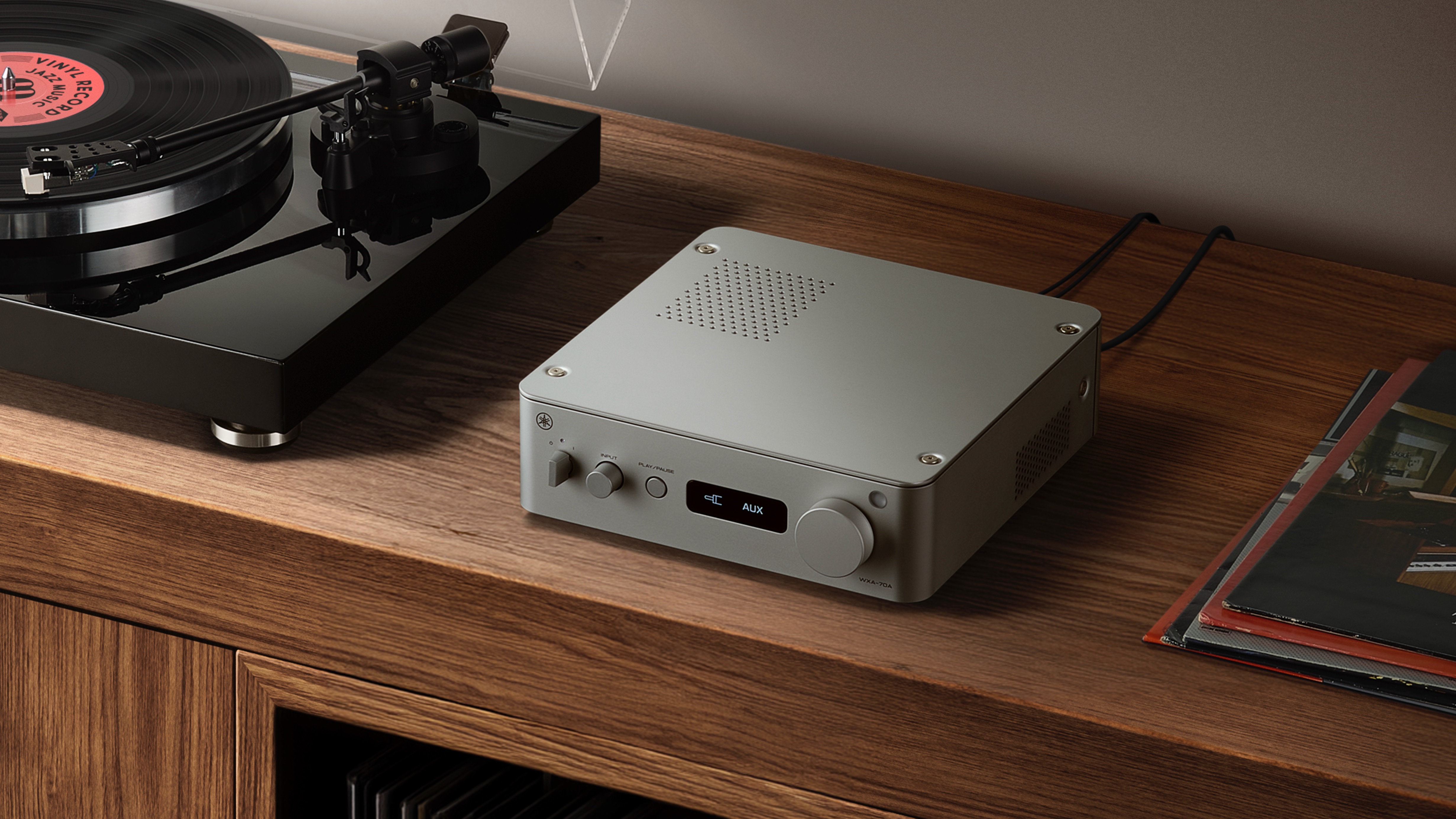 Yamaha WXA-70A streaming amplifier on wooden shelf