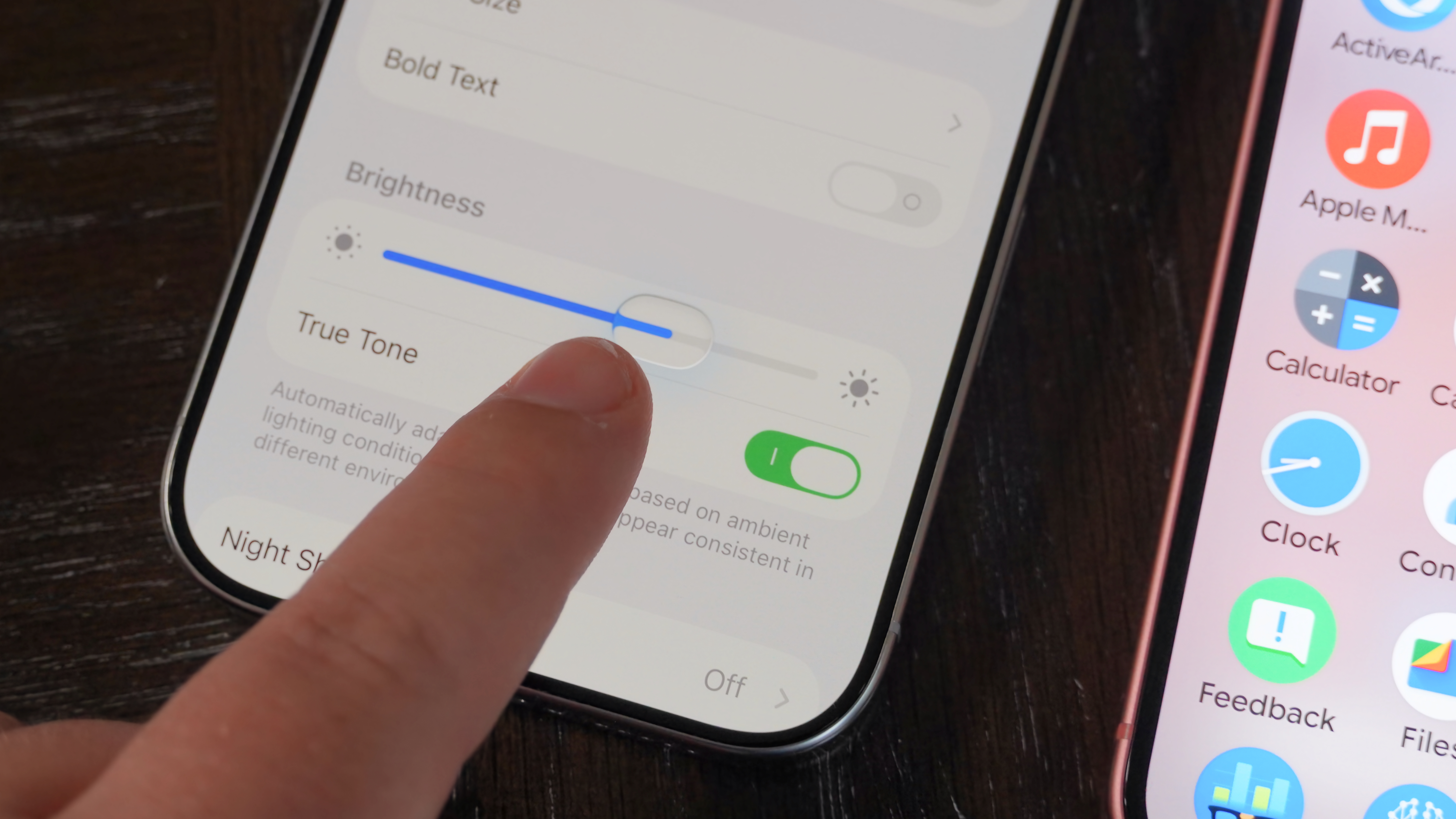 A comparison of UI sliders in iOS 16's Liquid Glass and Android 16's Material 3 Expressive.