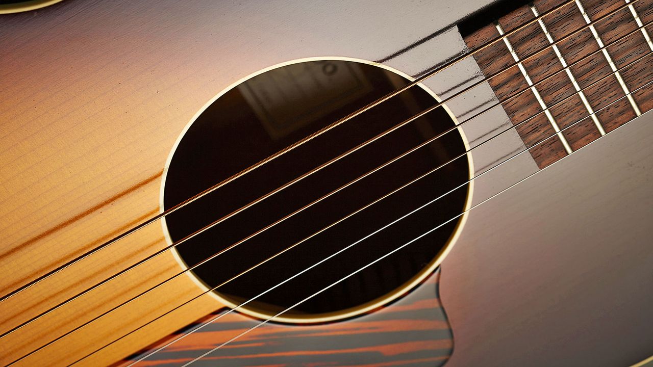 The body and soundhole are bound/ finished in ivoroid for the merest hint of aesthetic adornment