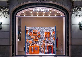 Window display shows a fox in its house made of paper