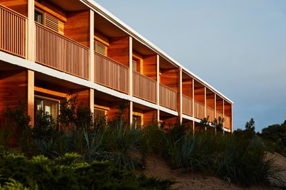 The wooden façade of the Marram Hotel, Montauk, featuring square balconies facing the sea