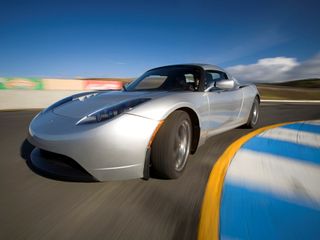 Tesla's electric roadster will soon be available in the UK, but it won't be until 2015 until electric cars goes mainstream