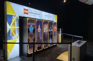 An interactive display in the Lego Education Build to Launch: A STEAM Exploration Series exhibit invites guests at the Kennedy Space Center Visitor Complex to meet the Lego Space Team and the roles they fill for NASA's Artemis I mission.