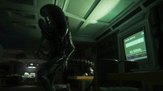 Image from the video game Alien: Isolation. It's a point of view shot from your character. You see an Alien looming above you, with a faint green glow from a monitor filling in the dark room.