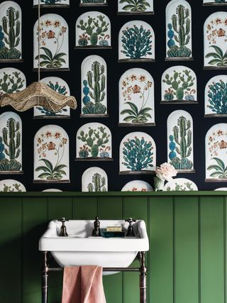 bathroom basin against patterned wallpaper