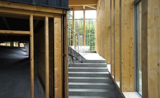 vertical timber elements with polished concrete floors