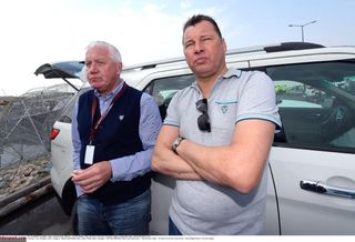 Patrick Lefevere and Wilfried Peeters wait at the finish