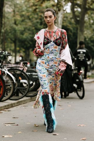 woman wearing furry boots at Paris Fashion Week