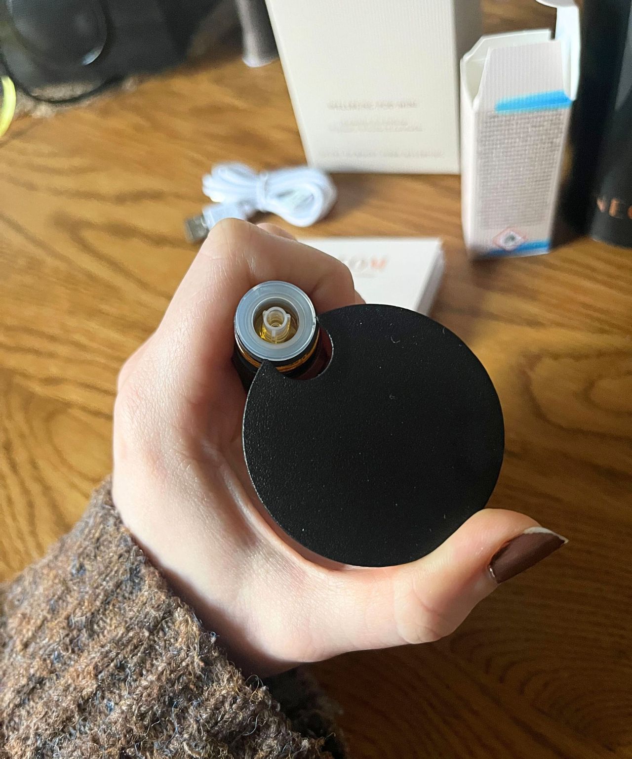 The tool used to remove the caps from the NEOM oil bottles