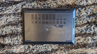 Asus Zenbook 14X OLED laptop on carpet