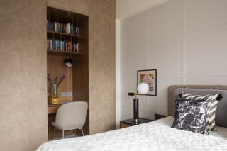 A bedroom with a small closet office