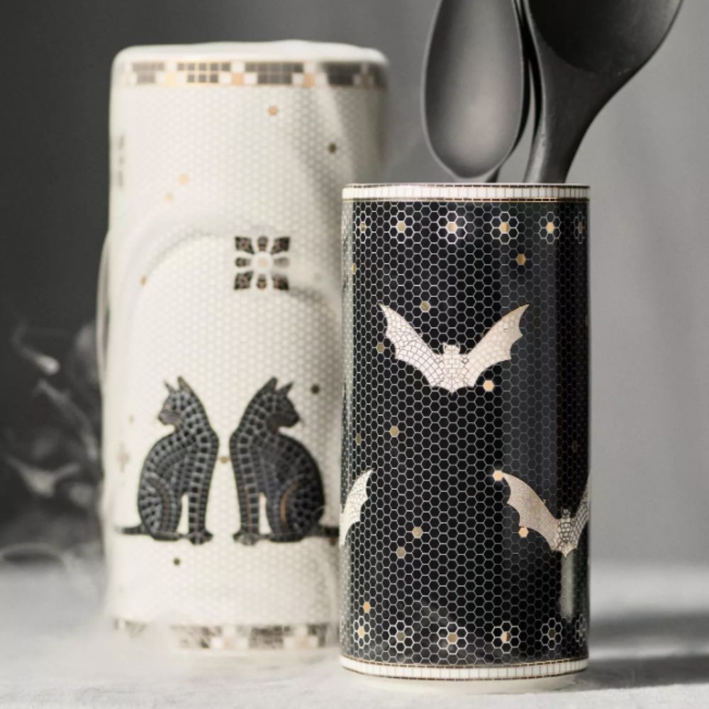 two black and white bistro tile utensil pots with cat and bat designs
