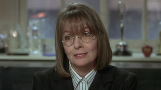 Diane Keaton in a blazer and circular glasses in 1996's The First Wives Club