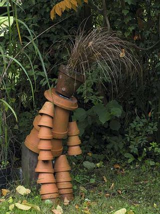 a plant pot man in the garden in hampshire