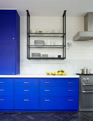 A royal blue and white kitchen