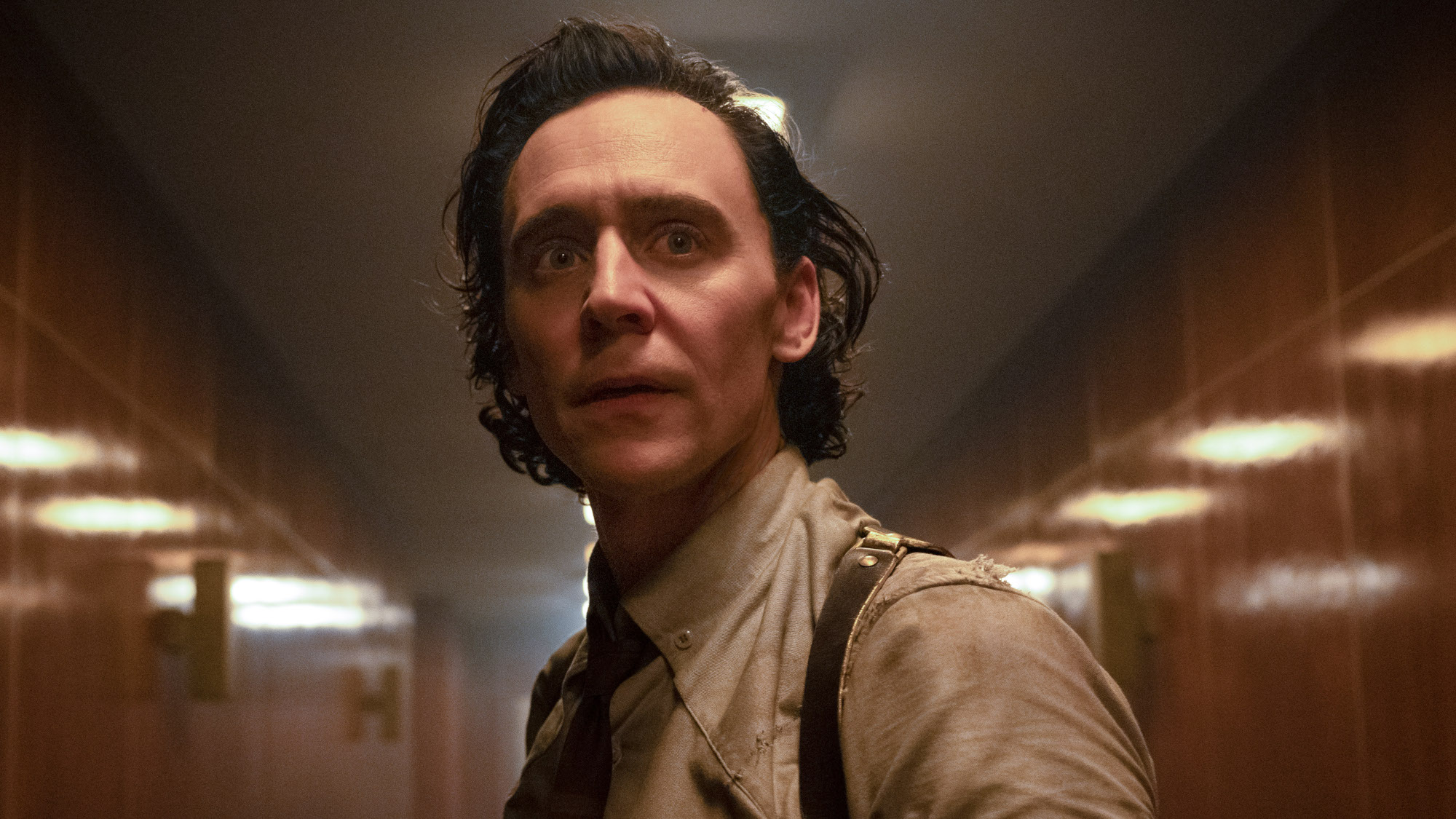Loki (Tom Hiddleston) looks ahead in Loki.