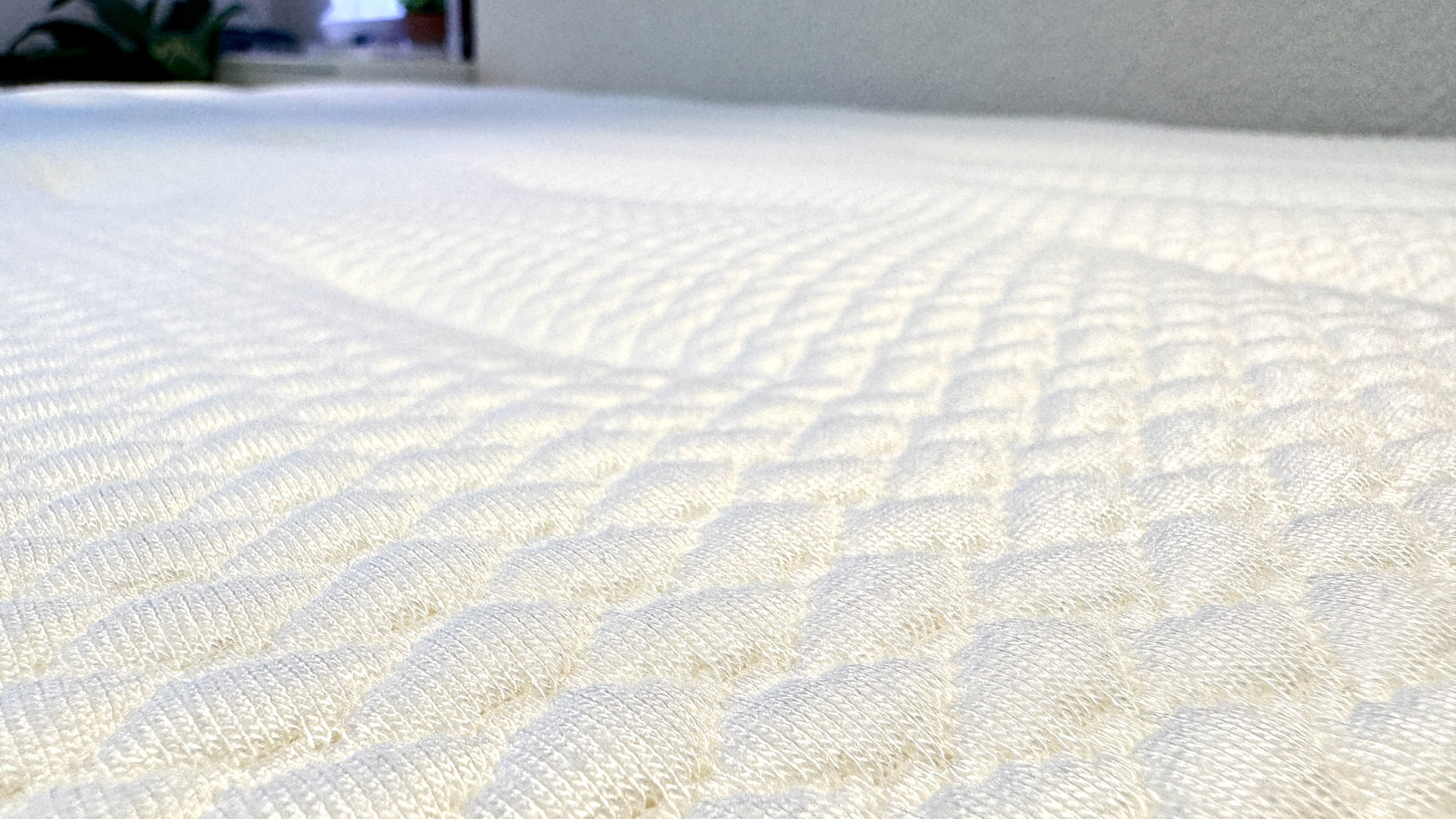 A close up of the knitted fabric top of the Yinahla Premier Luxe mattress