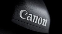 A closeup on the Canon logo on a camera