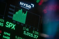 A monitor displays the S&P 500 index crossing 5000 on the floor of the New York Stock Exchange 