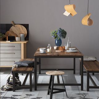 Dinning room with grey wall and wooden flooring