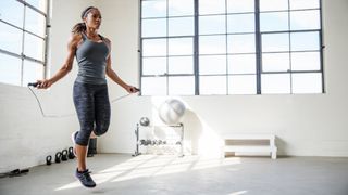 Women exercises with a jump rope
