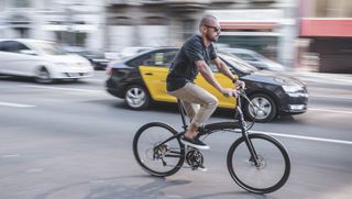Male cyclist riding the Tern folding bike