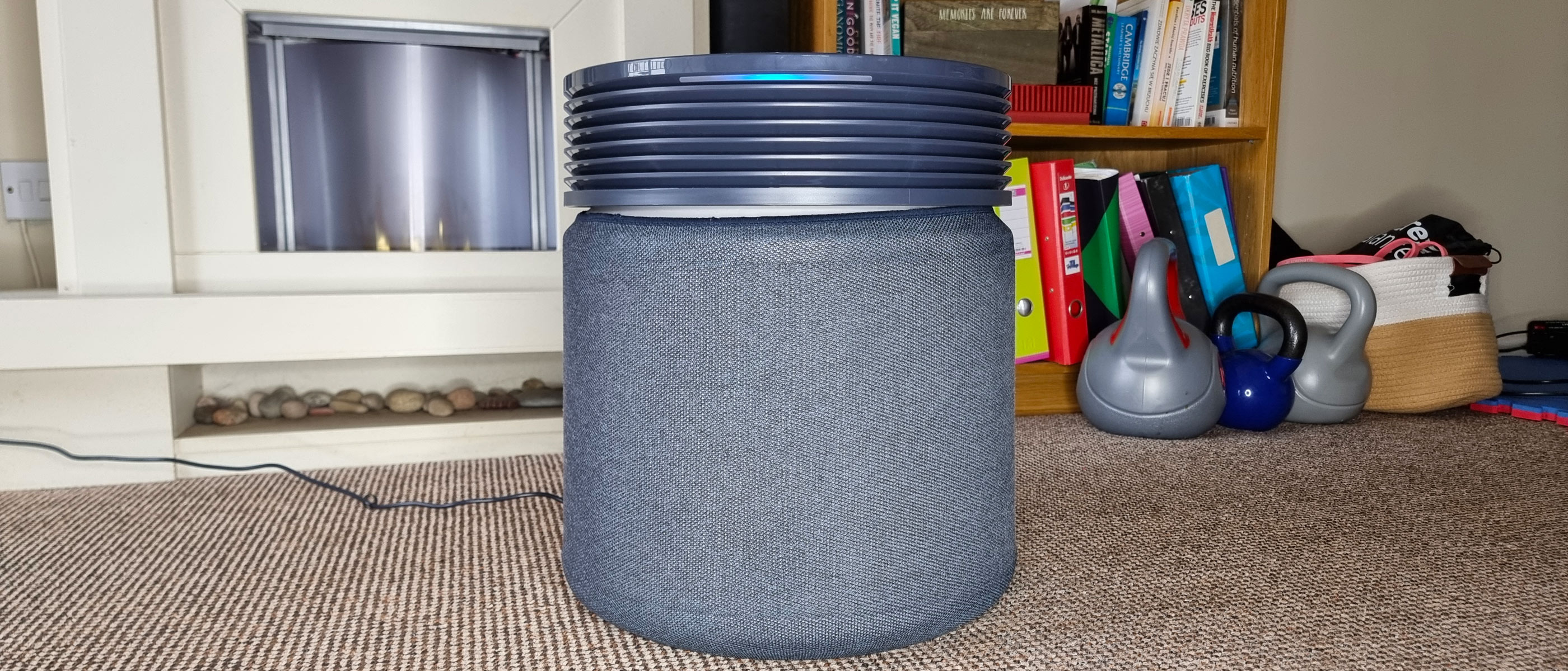 The Blueair Blue Signature air purifier standing in the middle of a living room