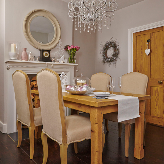 dining room with wooden dining table and round mirror