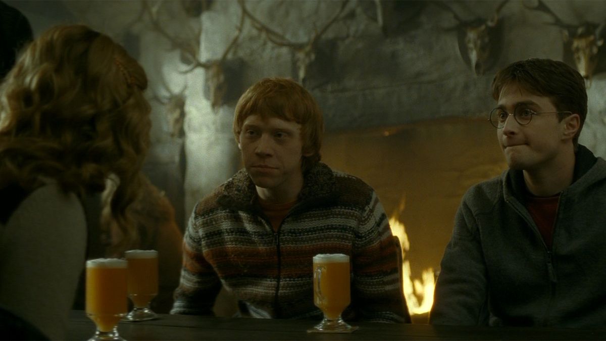 Emma Watson, Rupert Grint, and Daniel Radcliffe enjoy some Butterbeer in Harry Potter and the Half Blood Prince.