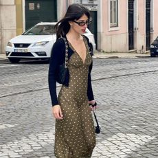 @tamaramory wearing a polka dot dress and cropped cardigan