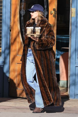 Hailey Bieber wearing a brown fur coat in Aspen