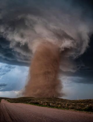 Photographer Tori Jane Ostberg writes: "An incredible EF2 tornado tears through a rural Colorado field after destroying a home. This tornado marked my very first day of my very first great plains storm chase adventure, and it was only a sign of the incredible things to come."