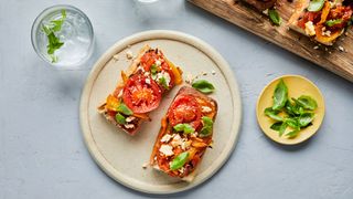Roasted tomato and feta toast on a plate