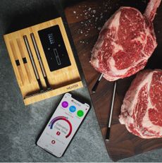 smart barbecues wireless Meater temperature probes in raw steak