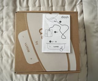 Lumie Dash lamp box with instruction leaflet placed on top