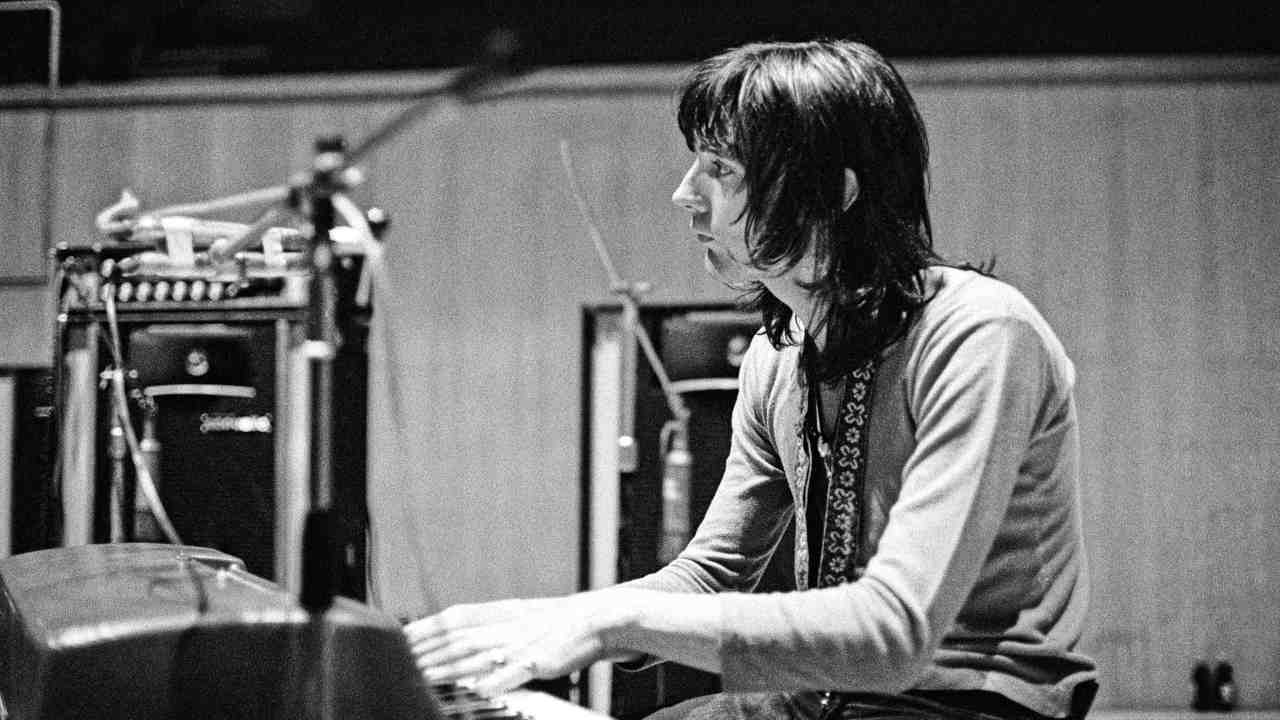 Chris Wood playing piano in the studio in 1971