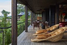 Xigera Safari Lodge patio with chairs by Porky Hefer