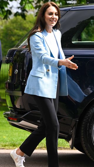Catherine, Princess of Wales greets people during a walkabout meeting members of the public on the Long Walk near Windsor Castle