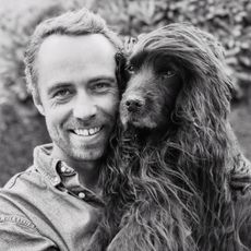James Middleton holding his dog, Zulu