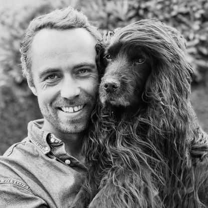 James Middleton holding his dog, Zulu
