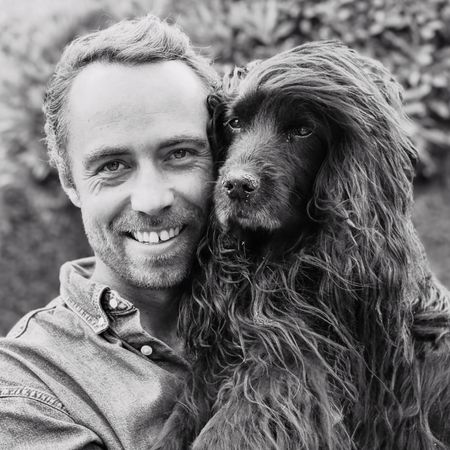 James Middleton holding his dog, Zulu