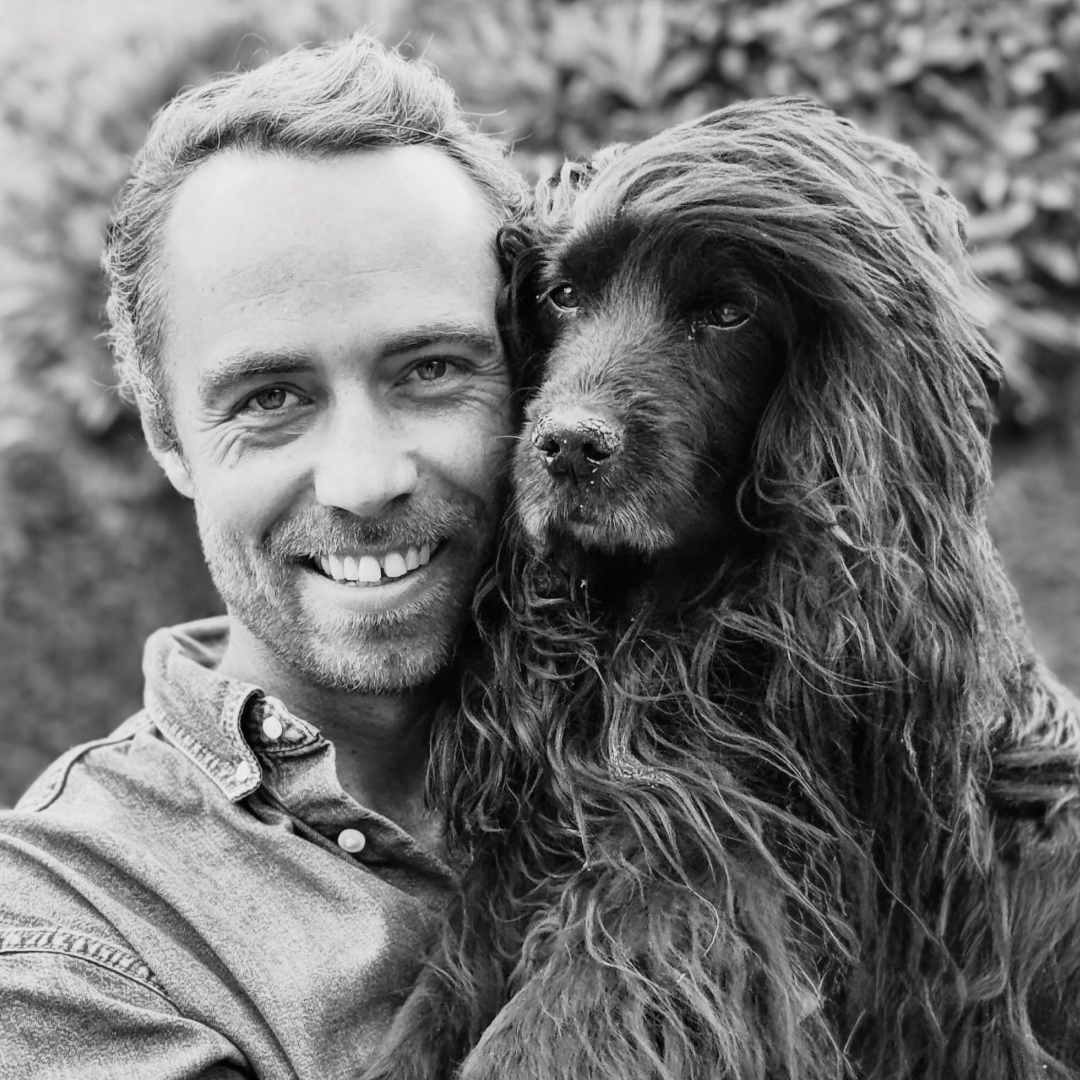 James Middleton holding his dog, Zulu