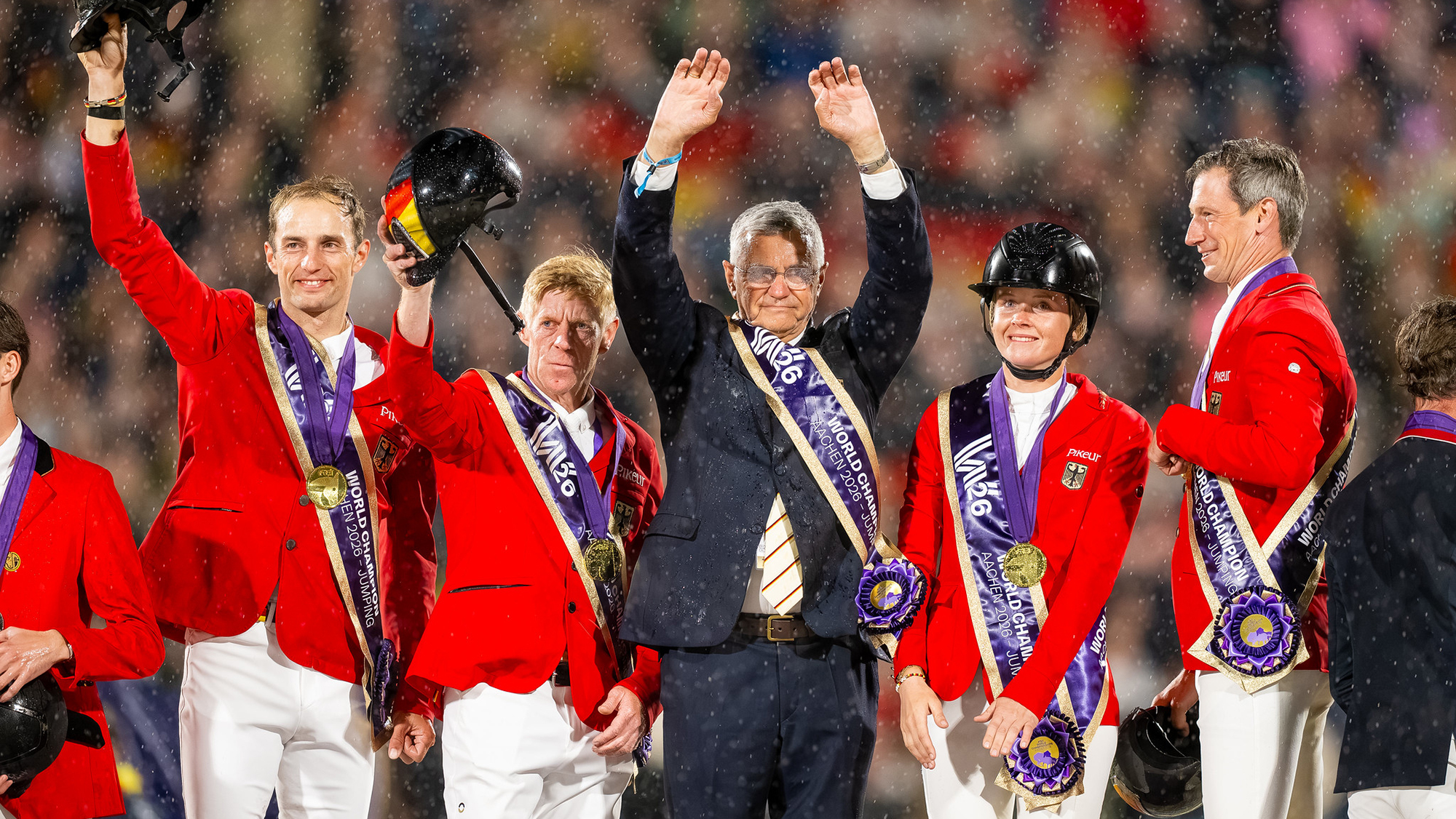 Chef d&amp;rsquo;equipe Otto Becker and four German riders in red coats on the podium after winning gold in the showjumping World Championships team results