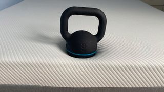 An 8kg kettlebell on the edge of the Hypnia Supreme Memory Mattress