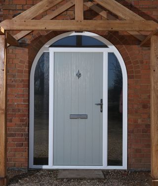grey composite front door with arch glazing