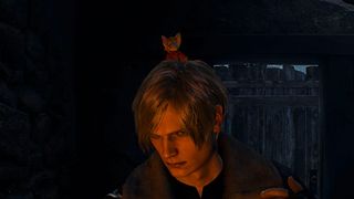 A mouse version of Ashely sits atop Leon's head