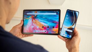 Holding up a TCL Tab 10 NXTPAPER 5G tablet and a OnePlus Nord N30 5G phone to examine the LCD panels